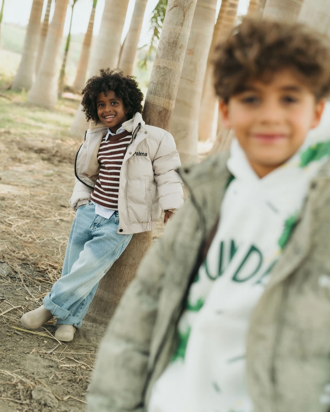 Children exploring the palm grove in Palma outfits